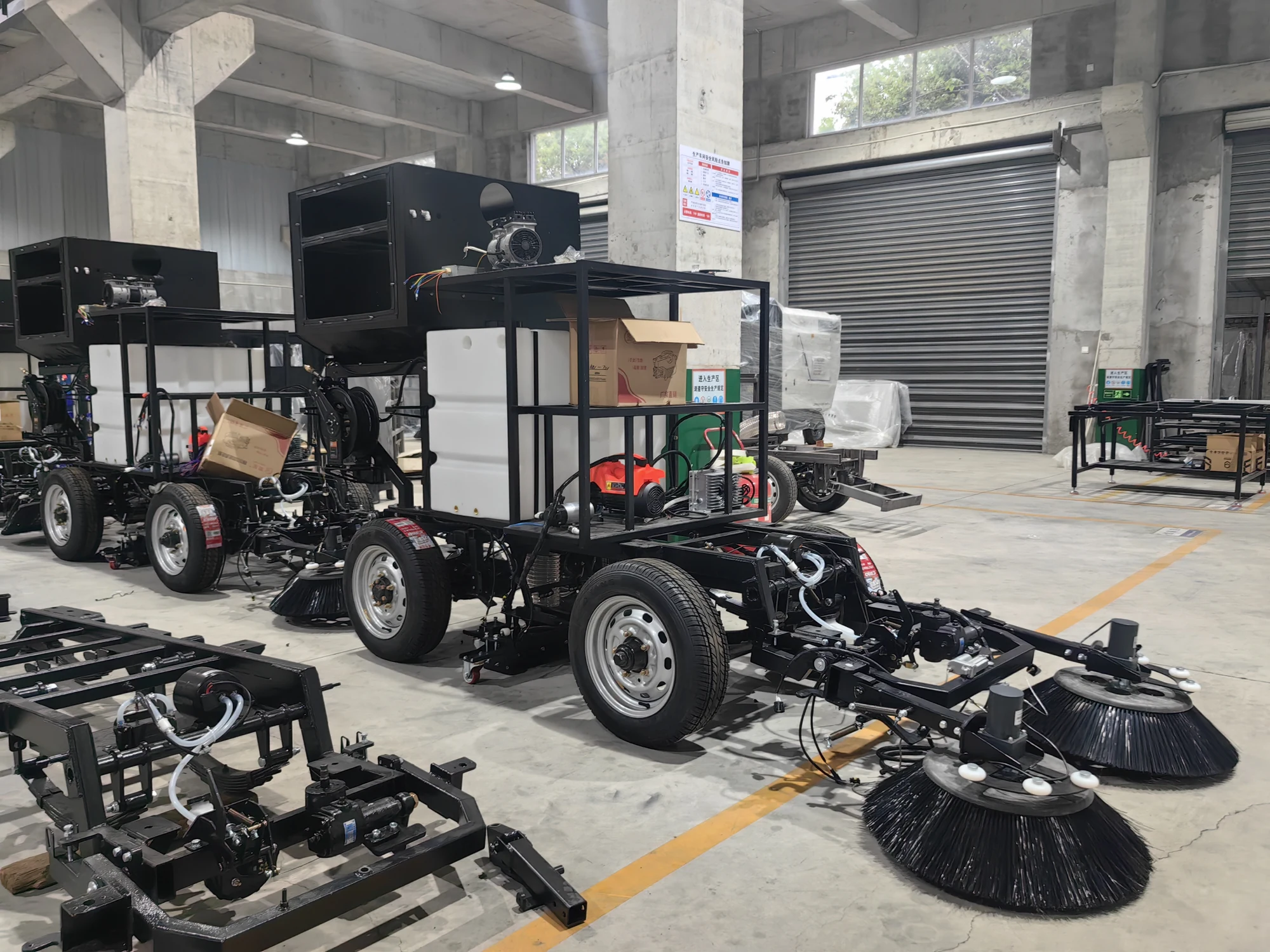 Electric road sweeper chassis assembly in the SINOPOWER workshop